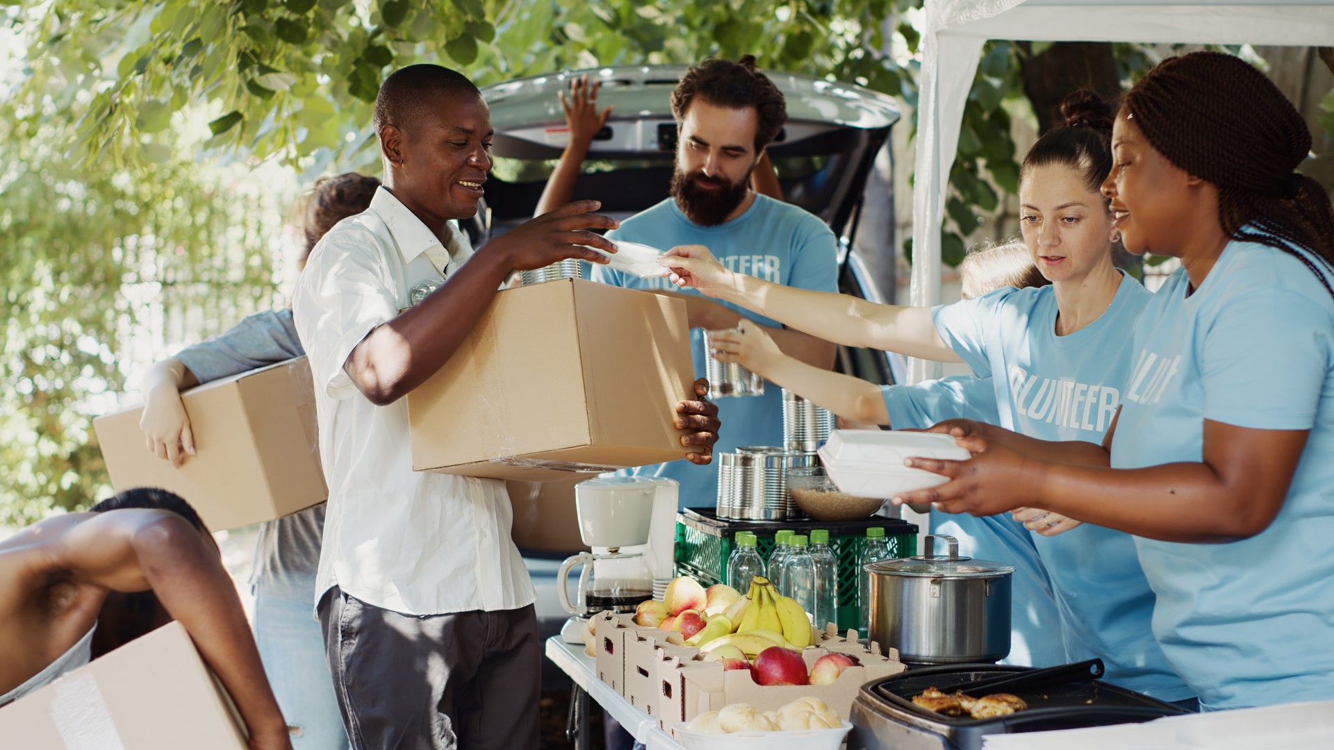 Volunteers Handing Out Donation Packages